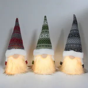 Set of three LED lighted Christmas gnome dolls with knitted hats and faux fur beards.