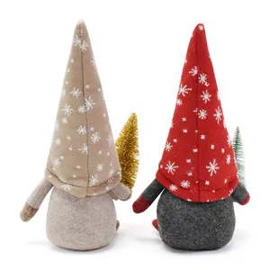 Detailed back view of plush Christmas gnomes with snowflake hats and mini trees decorations