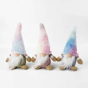 Three plush gnomes with long white beards and colorful tie-dye hats on white