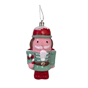 Detailed view of plastic Nutcracker Christmas ornament with glitter and hanging loop