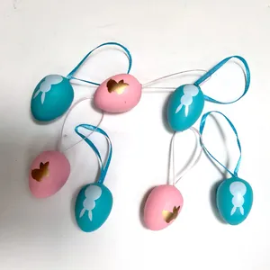 Juego decorativo de huevos de Pascua de plástico azul y rosa con dibujos de conejos y cintas