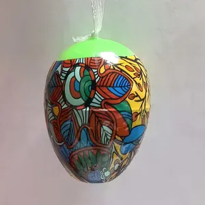 Detailed view of a colorful Easter egg hanging ornament with vibrant floral patterns