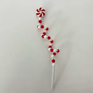 Handcrafted red and white spiral candy cane Christmas tree pick for festive holiday DIY decor