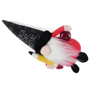 Detail of Teacher's Day gnome doll with 'TEACH LOVE INSPIRE' hat and pencil prop.