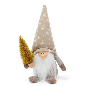 Detailed view of a Christmas gnome plush with resin face holding a mini golden tree