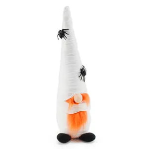 Detailed view of a Halloween mummy gnome plush with orange beard and black spiders