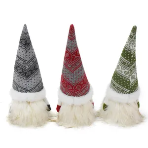 Set of three handmade Christmas gnome dolls with tall knitted hats and plush white beards
