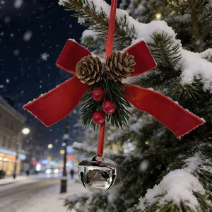 Exquisite detail of red velvet bow Christmas bell ornament with pine cones and berries