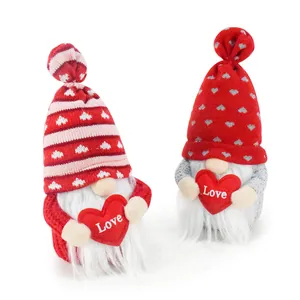 Detailed macro view of two Valentine's Day plush gnomes holding red hearts with Love text