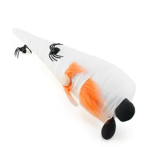 Detail view of a Halloween mummy gnome with orange beard and black spiders