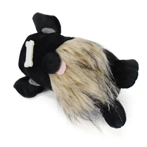 Close-up of black dog gnome plush ornament featuring a bone detail and a long fuzzy beard