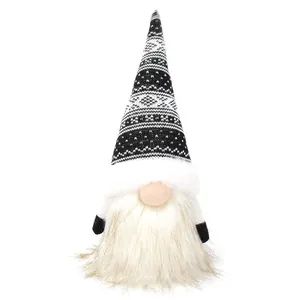 Detail of Christmas gnome plush with black and white knit hat and long faux fur beard