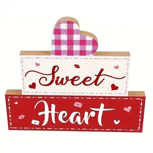 Close-up of Valentine's Day wooden tiered sign featuring Sweet Heart text and heart shapes