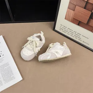 Stylish girls' cream sneakers with bow detail and non-slip thin sole for spring