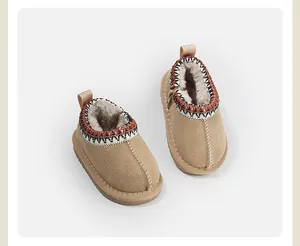 Cozy khaki toddler snow boots with plush lining and patterned trim for winter warmth