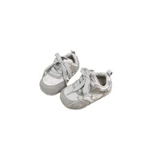 Stylish silver girls' sneakers featuring decorative pearl bows and durable anti-slip soles
