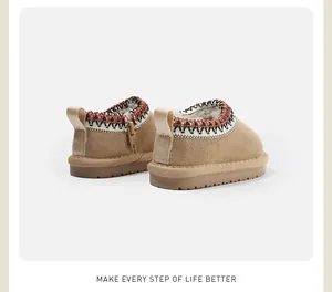 Detailed rear view of warm children's snow boots with embroidered collar and zipper