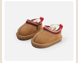 Cozy brown baby winter snow boots with thickened white fleece lining and ethnic trim detail