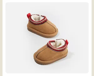 Warm brown toddler snow boots featuring soft plush lining and decorative ethnic trim.