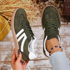 Retro women's green suede German Army Trainers casual sneakers with white stripes and gum sole