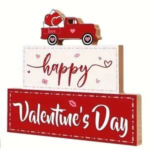 Close-up of tiered wooden Valentine's Day sign with red truck and heart motifs