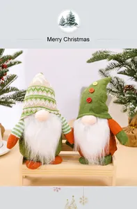 Detailed view of two festive Christmas gnomes with knitted hats and plush beards on a bench