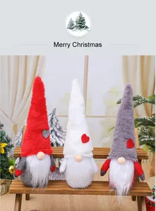 Set of three Christmas gnome plush dolls on a wooden bench for festive holiday decor