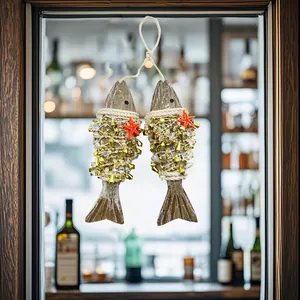 Detailed view of nautical wooden fish hanging decor with golden beads and red starfish