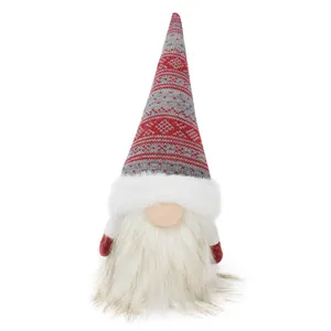 Detailed shot of Christmas gnome doll with red knit hat and long white beard