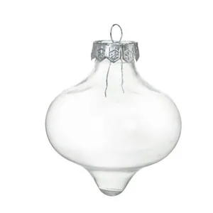 Close-up detail of a clear hollow glass onion-shaped Christmas ornament bulb decoration.