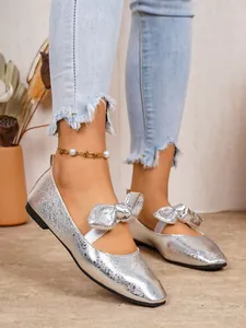 Elegant silver metallic Mary Jane flat shoes with bow tie and trendy square toe
