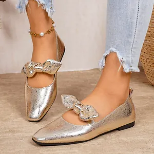 Elegant gold metallic flat Mary Jane shoes with stylish bow detail for fashion women
