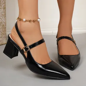 Elegant black pointed-toe slingback block-heel pumps shown in a stylish worn-on-foot view