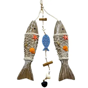Handcrafted nautical wooden fish wall decor featuring rope netting, shells and starfish
