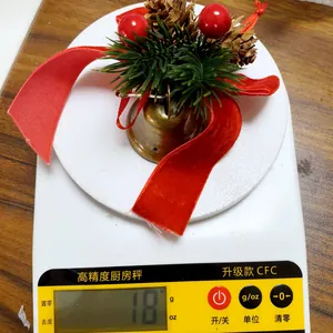 Christmas bell pendant with red velvet bow and pine cones weighing 18 grams