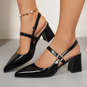 Detail view of black pointed-toe slingback Mary Jane pumps with a sturdy block heel.