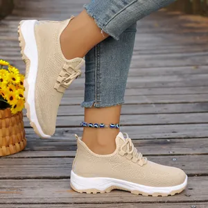 Detail of breathable mesh walking shoes for elderly, lightweight soft sole design.