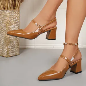 Detail of vintage brown pointed-toe slingback sandals with comfortable block heels