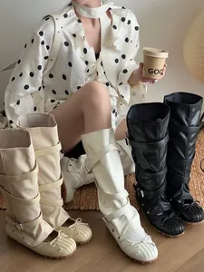Detailed view of stylish two-wear detachable ballet boots with chic bows and buckles