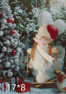 Detailed view of white knit Christmas elf doll ornament with wooden skis on snow