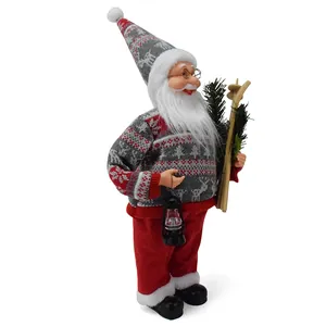 Close-up detail of standing Santa Claus figurine wearing a knitted reindeer sweater