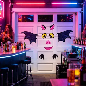 Cartoon bat face stickers applied to a white garage door in a festive party setting