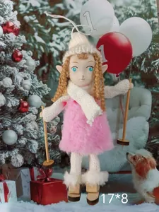 Detailed macro view of a pink plush Christmas angel doll ornament with wooden skis and poles