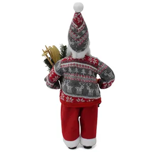 Detailed back view of a plush Santa Claus figurine holding wooden skis and pine needles