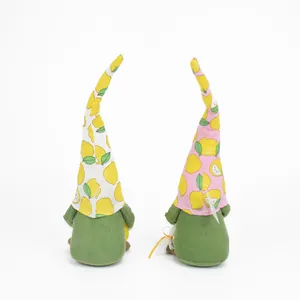 Back view of summer lemon themed handmade gnomes with white and pink patterned hats