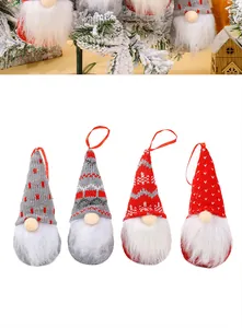 Set of four handmade Nordic knitted Christmas gnomes hanging ornaments for tree decoration.