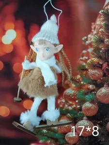 Close-up of a plush Nordic angel Christmas ornament with white knitted hat and skis