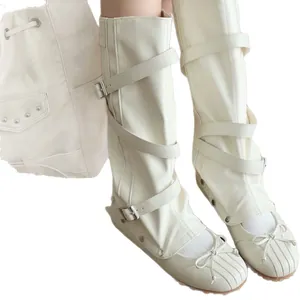 White detachable knee-high boots with ballet bow and multi-strap buckle details.