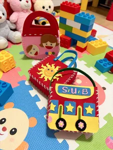 Detailed view of DIY felt sewing bags with colorful sun and bus cartoon designs for kids