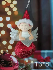 Detailed view of cute Christmas angel doll ornament with red sequins and silver wings